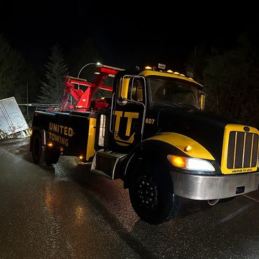 medium Duty Wrecker recovering a rollover Semi