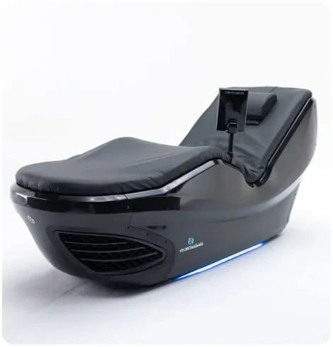 Futuristic black reclining chair with a screen attached.
