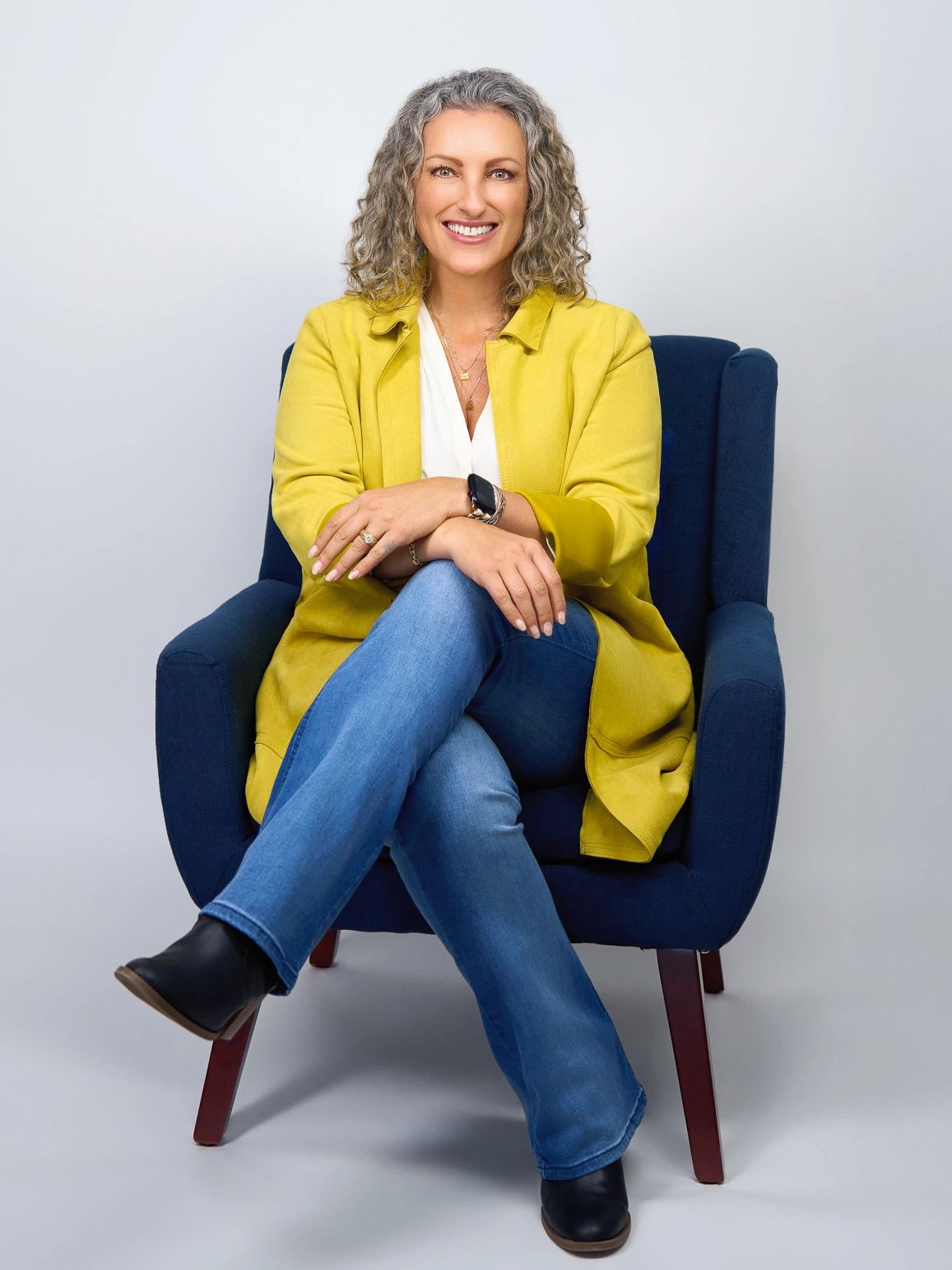 Tasha sitting in a chair