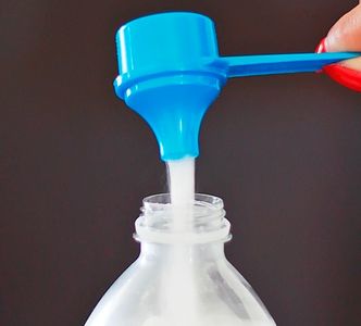 The Scoopie Pours Easily into Water Bottles