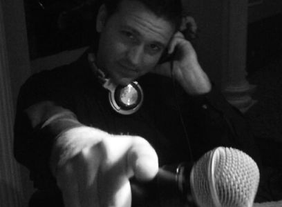 dj chameleon pointing at a camera