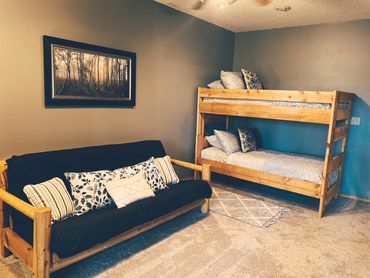 Open space in the lower level of Happy Daze Cabin VRBO listed with Lake State Property. 10 Guests