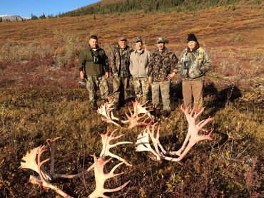Caribou hunters and a guide near end of hunt.