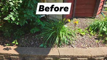 Flower bed beside red siding before the landscaping project, with the original Before label.