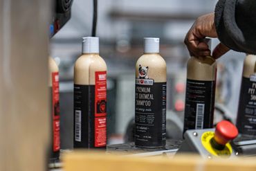 bottles labeled with shrink sleeves pet products at augusta label and packaging