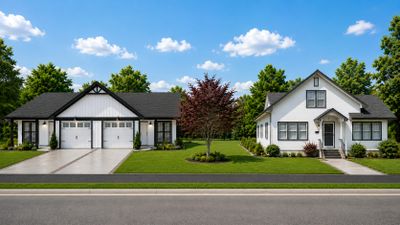 Two modern houses with manicured lawns under a blue sky.