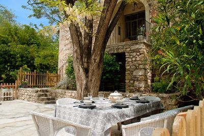 Outdoor dining area of a stone house in Montpellier, France