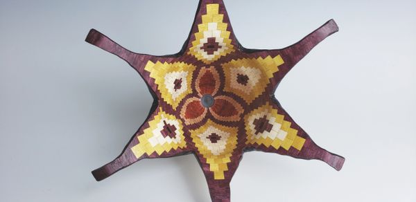 Inside view of flower bowl with all natural species of wood representing the colors.