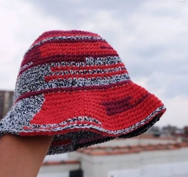 upcycled bucket hat made with left over scrap yarn in red, maroon, multi black