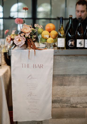 Seattle’s corporate event planner styled a sophisticated event bar with wine bottles.