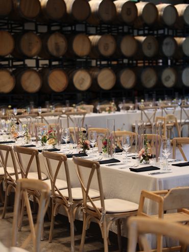 Seattle corporate event planner designed an elegant winery dinner setup with long banquet tables