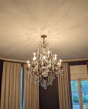 chandelier installation in dining room