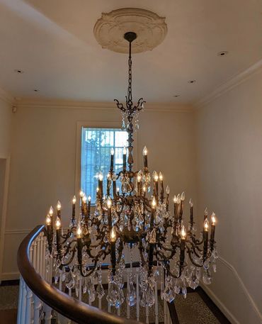 chandelier installation with crystals