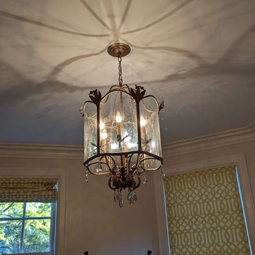 Glass light fixture in dining room
