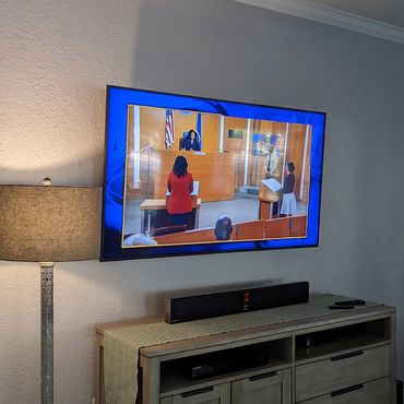 tv wall mount on wall over console in Houston, Texas