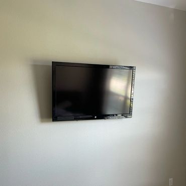 TV mount on wall in bedroom