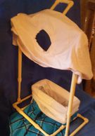 Photo of the Miracle Dressing Aid loaded with shit & shorts