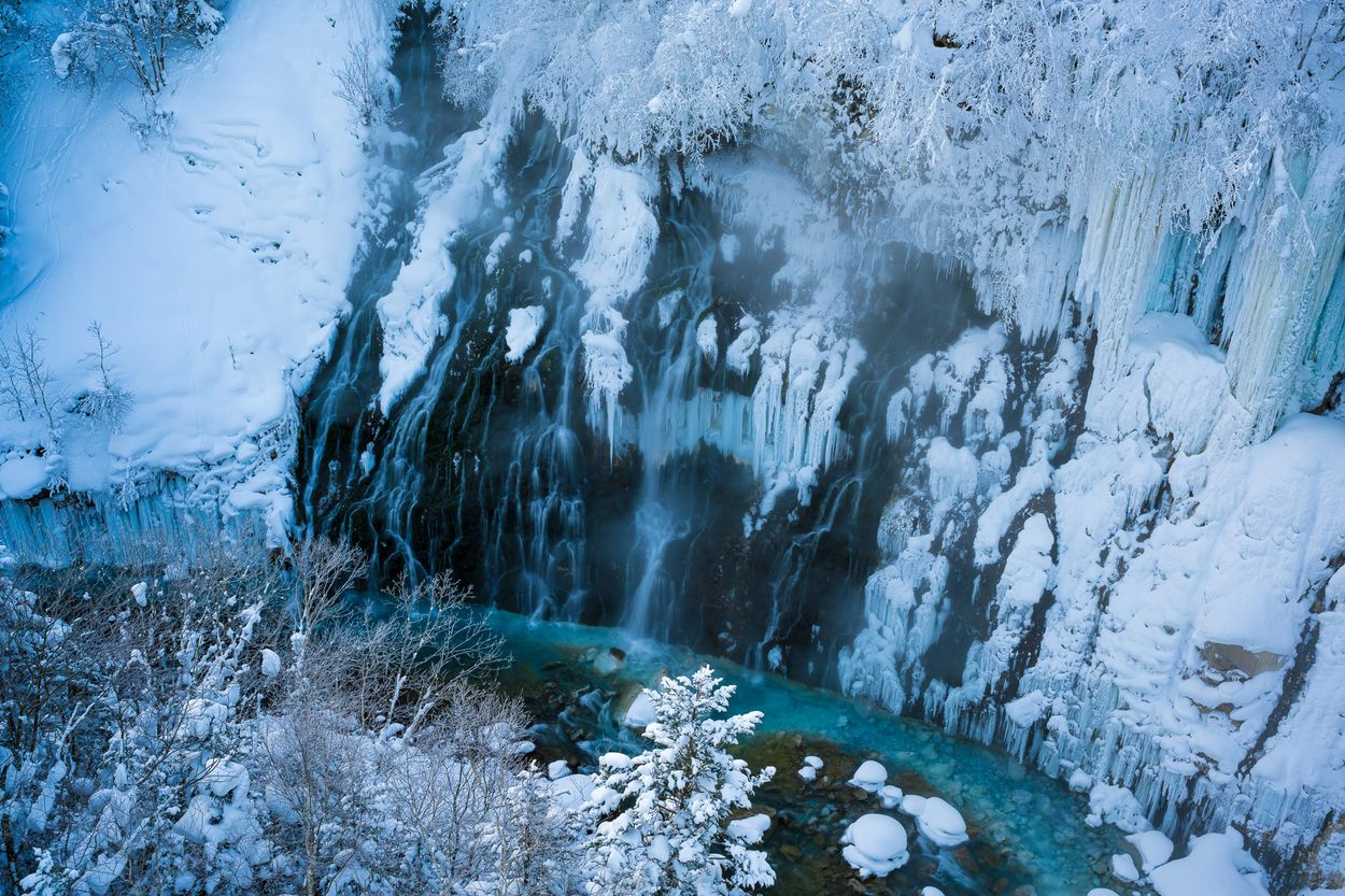 The Shirahige waterfall (blue waterfall) of steaming hot spring water.