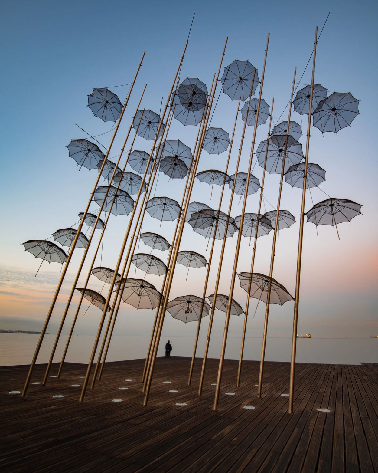 Long exposure of umbrella sculpture along the waterfront in Thessaloniki, Greece.