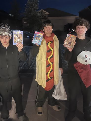 A group of teens proudly displaying the books they selected, highlighting their excitement for readi