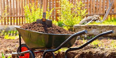 Photo of mulch and soil in wheel barrel; CIC can deliver and install