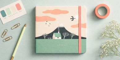 A notebook stationery and colour swatch to depict Good Egg's branding service