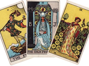 Three tarot cards: The Fool, The High Priestess, Nine of Pentacles.