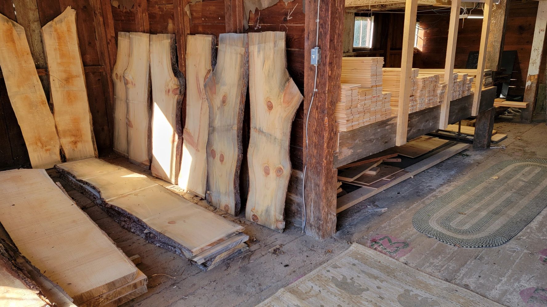 Stoney Brooke Sawyers wood inventory on shelves in barn.