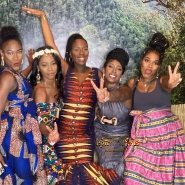 A group of women posing for pictures