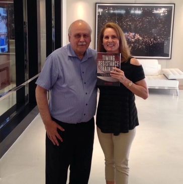 Amy Ashmore and Lee Samuels in Top Rank offices holding a copy of Timing Resistance Training