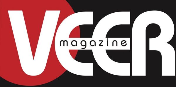 Logo of VEER magazine with bold white text on a black and red background.