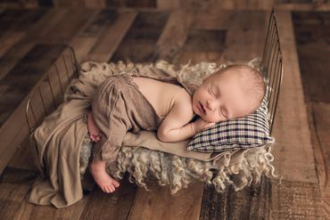 newborn baby sleeping on baby bed