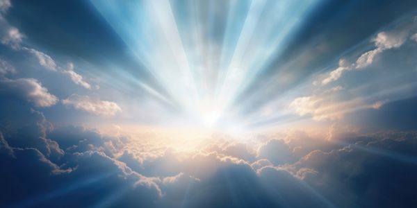 Sunlight bursting through clouds in a dramatic sky.