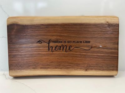 Black Walnut charcuterie board with custom laser engraving - There is no place like home.