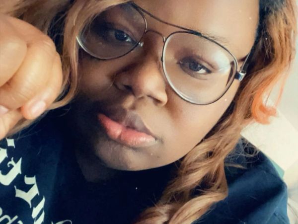 Close-up of a woman wearing glasses.