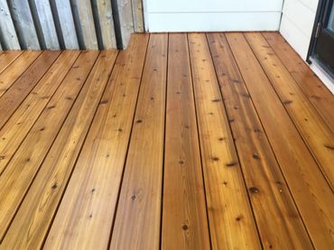 Beautiful wood texture and grain shining through a freshly stained deck in Toronto.