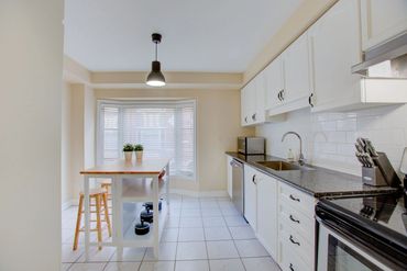 Kitchen has large bay window