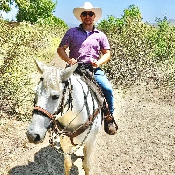 Rhett Strika Honorary Godparent CEO on horse 