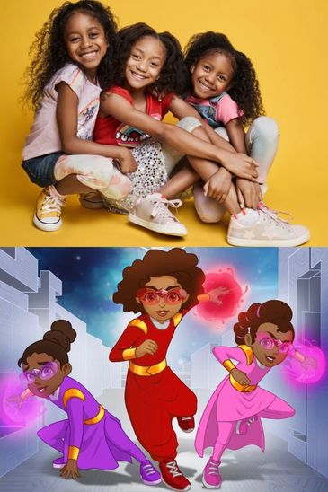 Three happy girls and their superhero cartoons.