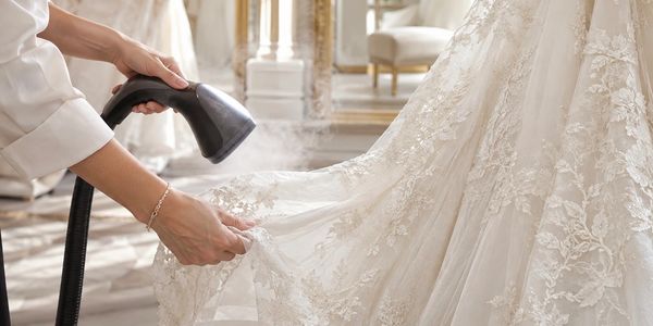 Close-up of professional wedding dress steaming care at Great Couture Fashion in Orlando, FL.