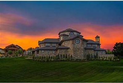 Large stone mansion at sunset.