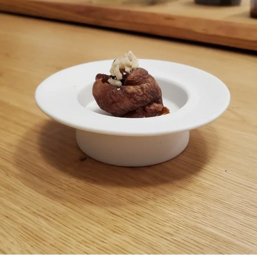 Semi dried persimmon on Porcelain hat plate.
