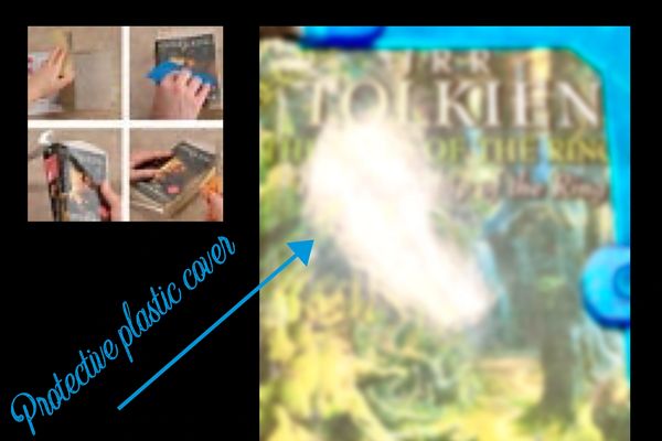 Demonstration of applying a protective plastic cover on a book.