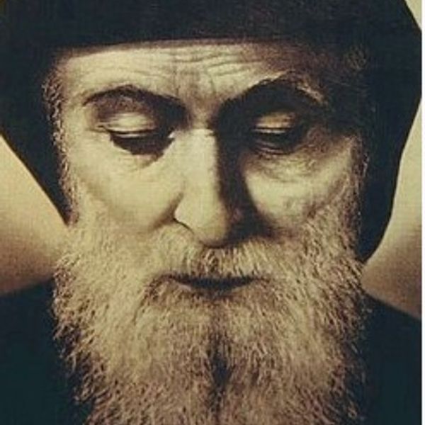 Close-up portrait of Saint Charbel Makhlouf with eyes closed and a serene expression.