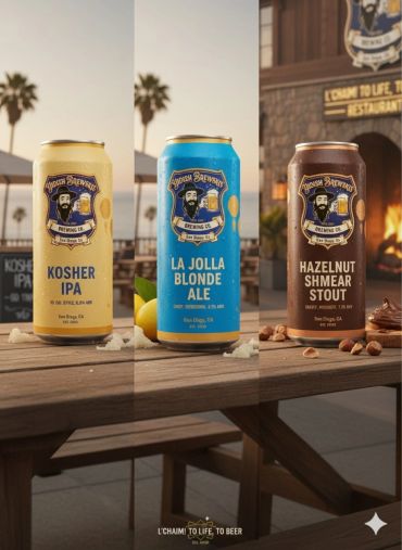 Three craft beer cans from Yiddish Brewhaus on a wooden table at sunset.
