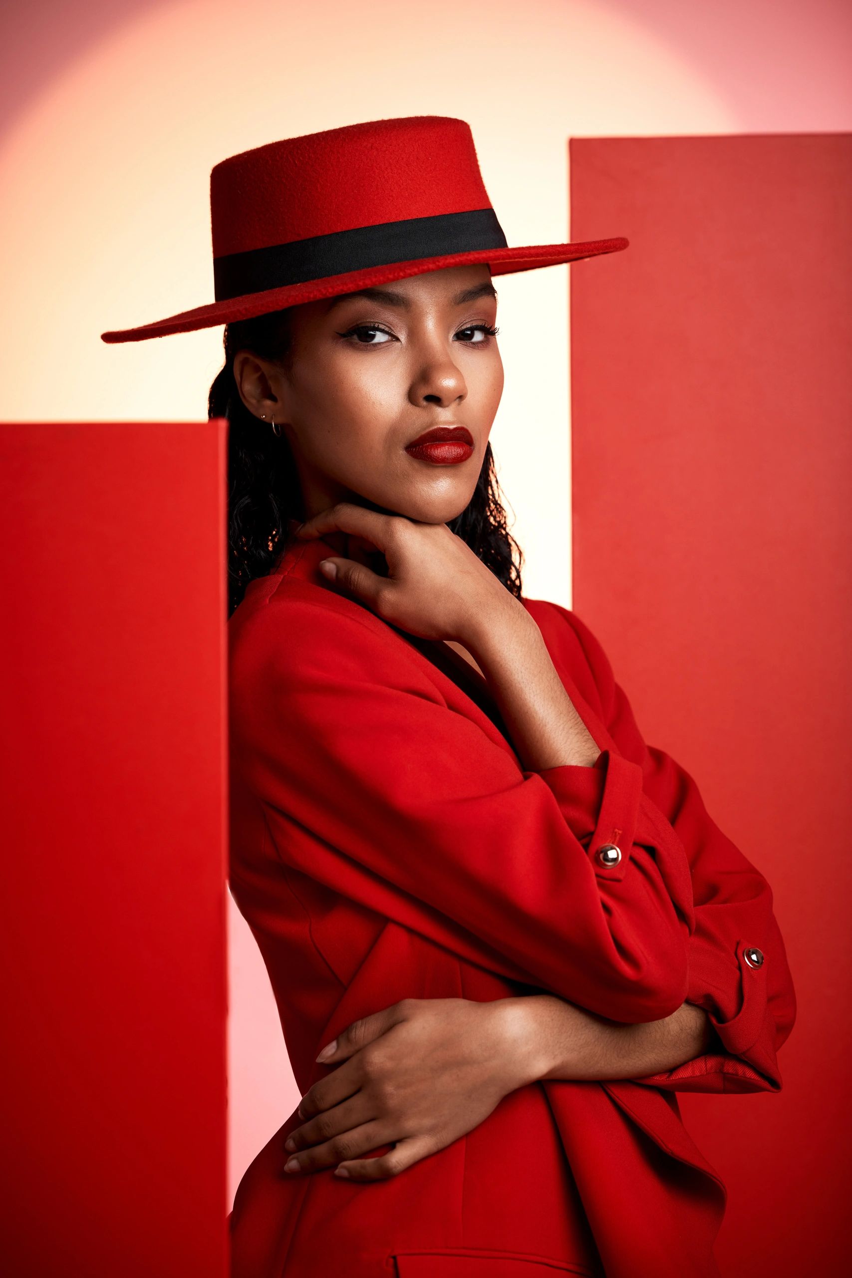 Woman in red suit. Gabi — from Unbreakable, Book 2 of the Sisters Trilogy by MiChele Mitchell.