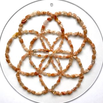Seed of Life in Sunstone and a fresh water pearl
