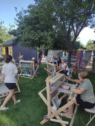 Perfect weather for a weaving party in an outdoor weaving studio.