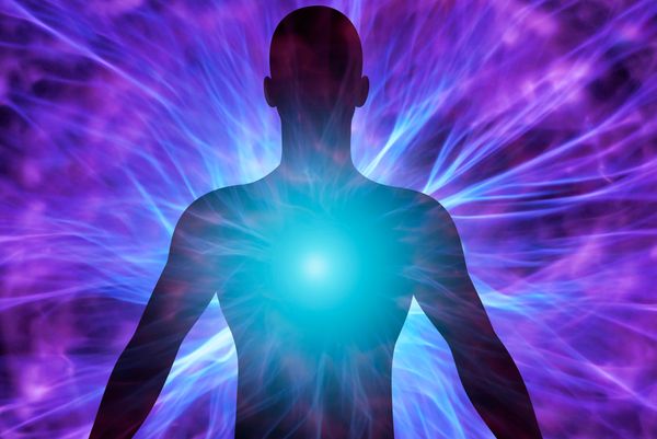 Abstract double exposure of man with closed eyes in pink and blue lighting