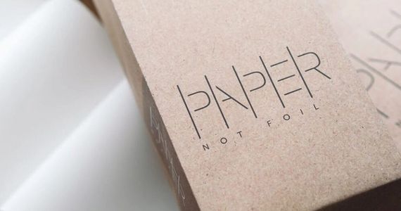 brown paper packaging on wooden desk
